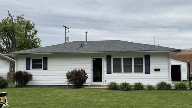 1021 Harney Dr, Lebanon, IN 46052 - rear view of house with a lawn and roof with shingles