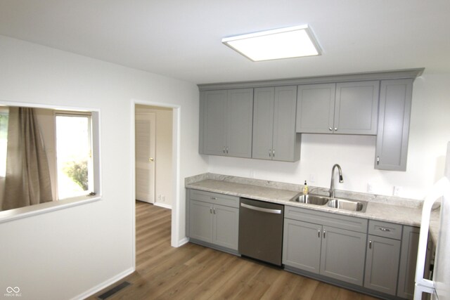 1021 Harney Dr, Lebanon, IN 46052 - kitchen featuring dishwasher, gray cabinets, and a sink