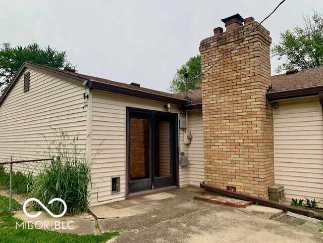1998 Crescent St, Franklin, IN 46131 - rear view of property with a chimney and a patio