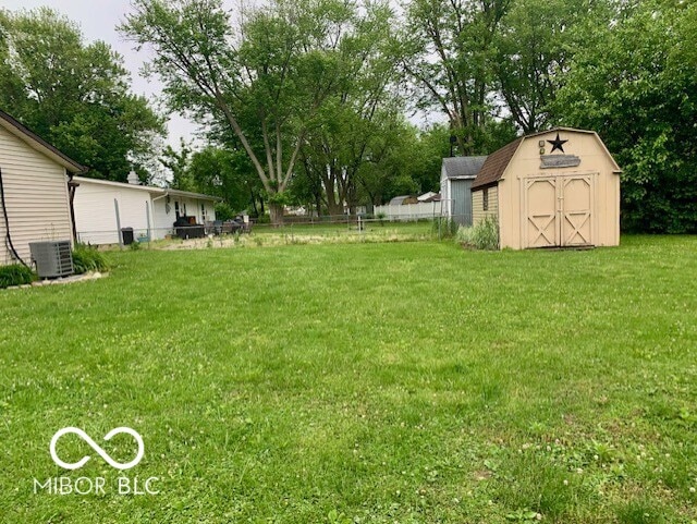 1998 Crescent St, Franklin, IN 46131 - view of yard with central AC and view of scattered trees