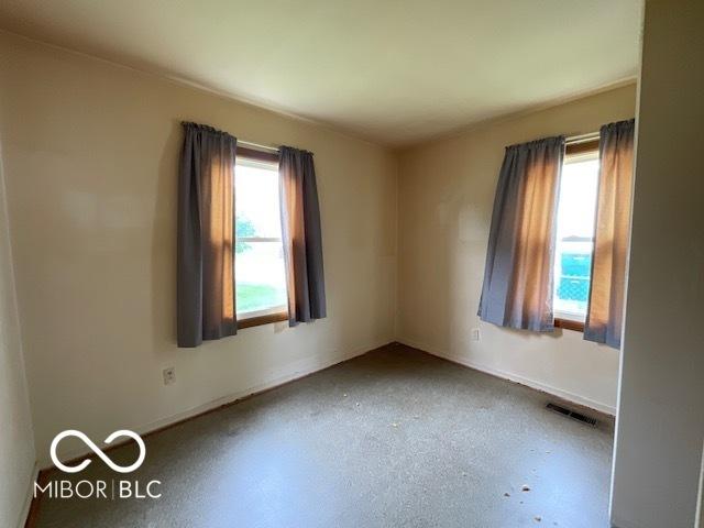 1998 Crescent St, Franklin, IN 46131 - empty room featuring plenty of natural light and baseboards