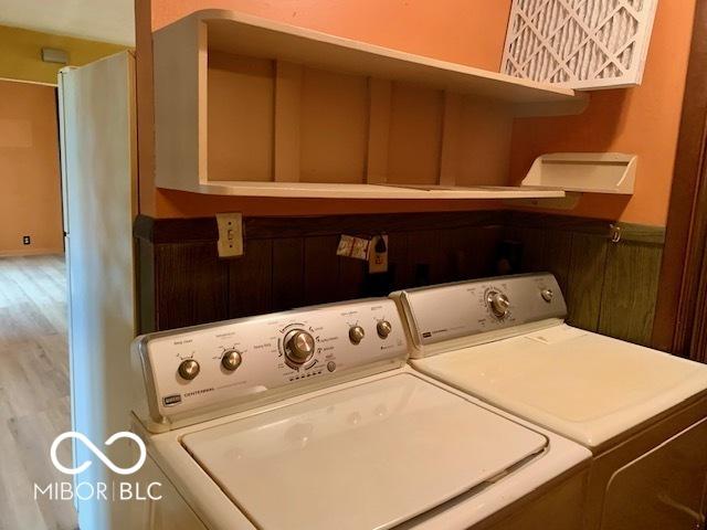 1998 Crescent St, Franklin, IN 46131 - laundry room featuring washer and clothes dryer and wood finished floors