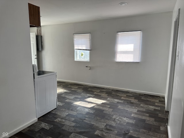 2310 E Raymond St, Indianapolis, IN 46203 - unfurnished dining area with washer / dryer and baseboards