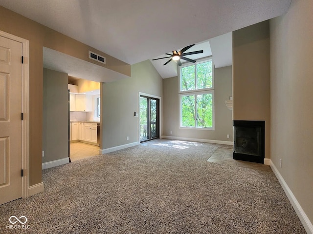 70 Lookout Ridge Dr, Columbus, IN 47201 - unfurnished living room with light colored carpet, a ceiling fan, a multi sided fireplace, baseboards, and lofted ceiling
