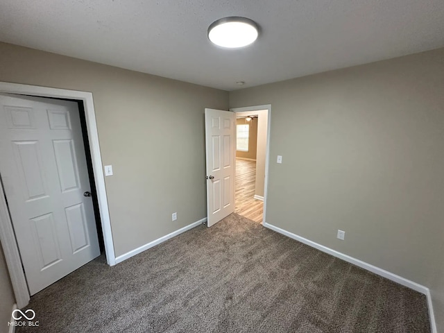 3861 Candle Berry Dr, Indianapolis, IN 46235 - unfurnished bedroom featuring carpet floors and baseboards