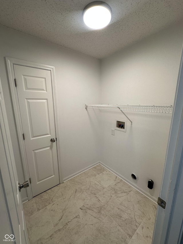 3861 Candle Berry Dr, Indianapolis, IN 46235 - laundry area featuring hookup for a washing machine, light marble finish flooring, and a textured ceiling