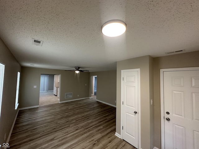3861 Candle Berry Dr, Indianapolis, IN 46235 - unfurnished room with wood finished floors, a textured ceiling, and a ceiling fan