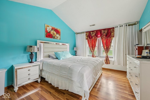 6627 Cobden Ct, Indianapolis, IN 46254 - bedroom with vaulted ceiling, light wood-style flooring, and baseboards