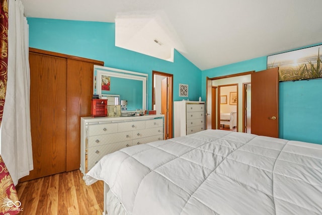 6627 Cobden Ct, Indianapolis, IN 46254 - bedroom with lofted ceiling and wood finished floors