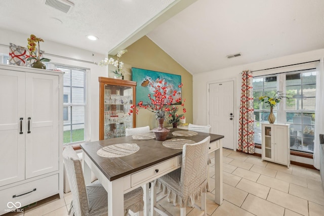 6627 Cobden Ct, Indianapolis, IN 46254 - dining room with vaulted ceiling, plenty of natural light, light tile patterned flooring, and recessed lighting