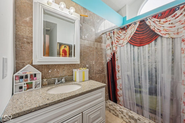 6627 Cobden Ct, Indianapolis, IN 46254 - bathroom featuring a shower with curtain, vanity, tile walls, and tasteful backsplash