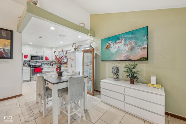 6627 Cobden Ct, Indianapolis, IN 46254 - dining room featuring light tile patterned floors, baseboards, and recessed lighting