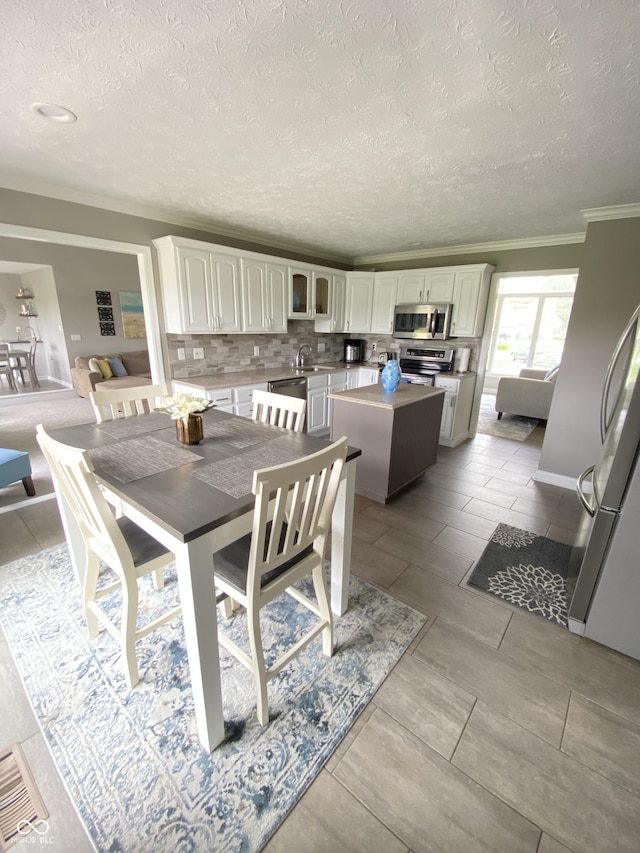 12231 Valley View Cir, Indianapolis, IN 46229 - dining area featuring ornamental molding and a textured ceiling