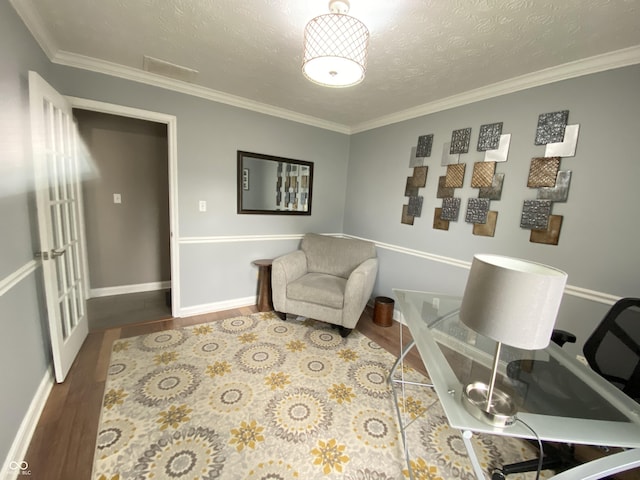 12231 Valley View Cir, Indianapolis, IN 46229 - living area with wood finished floors, crown molding, baseboards, and a textured ceiling