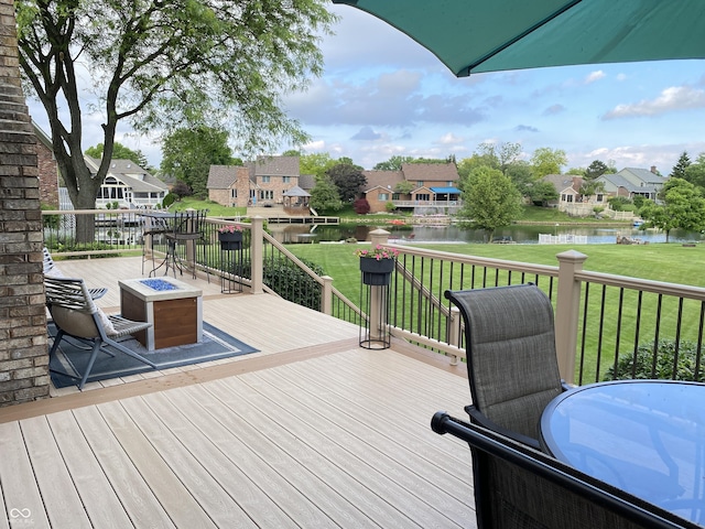 12231 Valley View Cir, Indianapolis, IN 46229 - wooden deck featuring a fire pit, a water view, a residential view, and a yard