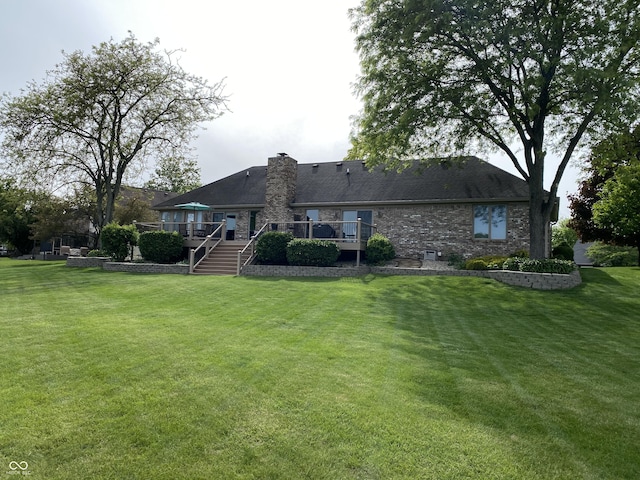 12231 Valley View Cir, Indianapolis, IN 46229 - rear view of house featuring a deck, a chimney, a lawn, and stairway