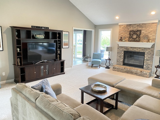 12231 Valley View Cir, Indianapolis, IN 46229 - carpeted living room featuring baseboards, a fireplace, recessed lighting, and high vaulted ceiling