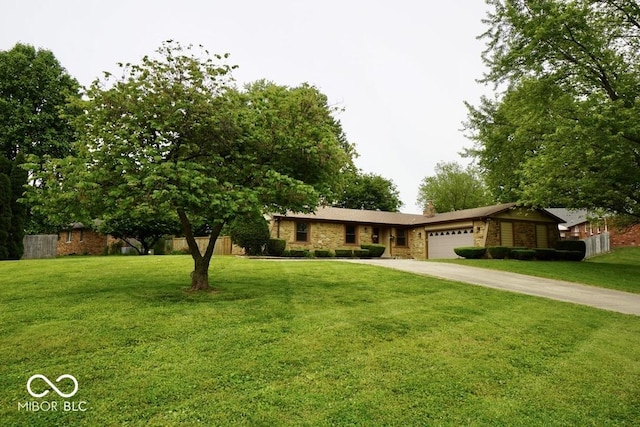 5331 Birch Ln, Greenwood, IN 46143 - ranch-style house with stone siding, a garage, concrete driveway, and a front yard