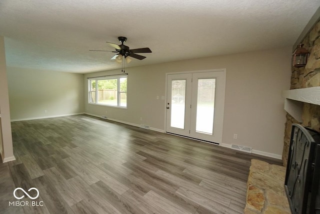 5331 Birch Ln, Greenwood, IN 46143 - unfurnished living room with a ceiling fan, wood finished floors, baseboards, and a fireplace