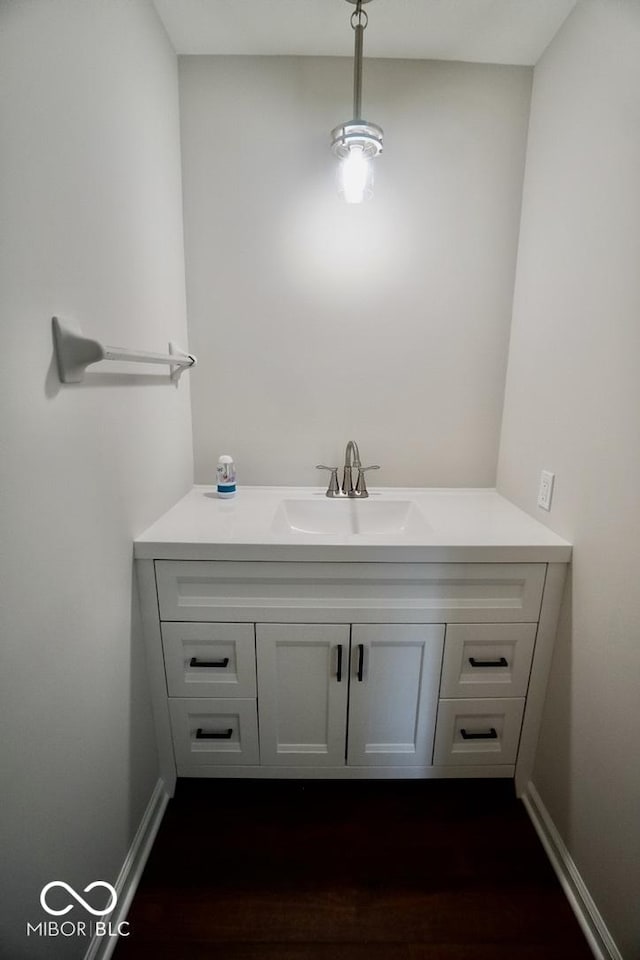 5331 Birch Ln, Greenwood, IN 46143 - bathroom with vanity, wood finished floors, and baseboards