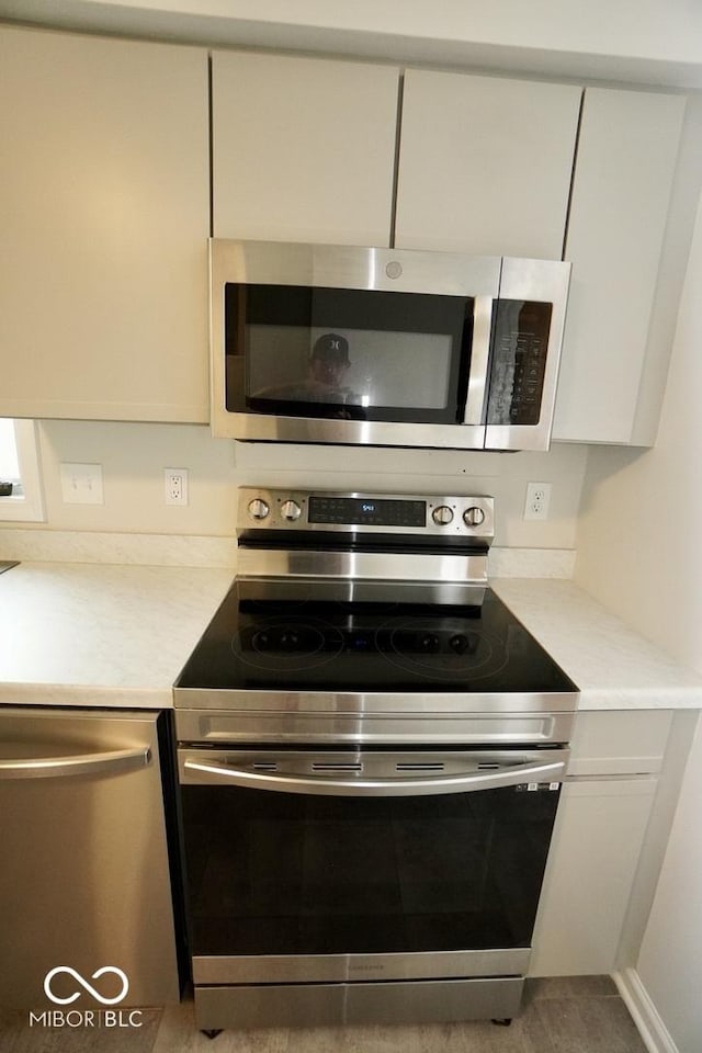5331 Birch Ln, Greenwood, IN 46143 - kitchen with stainless steel appliances and light countertops