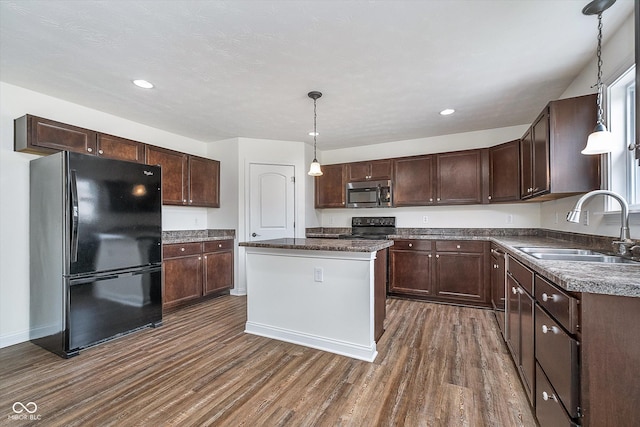 107 Elliott Ave, Trafalgar, IN 46181 - kitchen featuring black appliances, a sink, dark wood-style floors, dark brown cabinets, and a kitchen island
