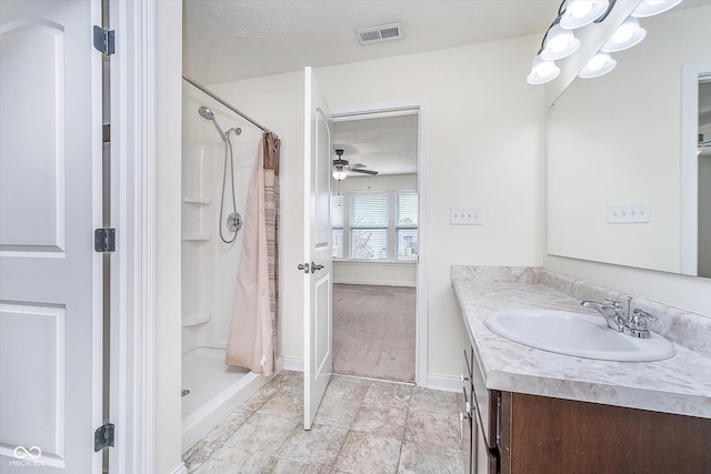 107 Elliott Ave, Trafalgar, IN 46181 - bathroom featuring vanity, ceiling fan, a stall shower, and baseboards