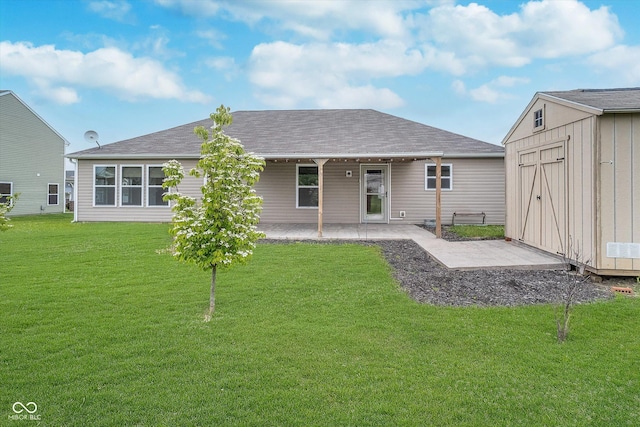 107 Elliott Ave, Trafalgar, IN 46181 - back of house featuring a patio, a lawn, and a shingled roof