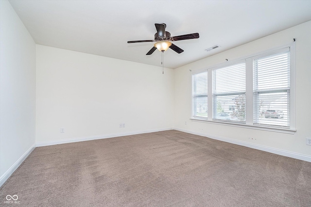 107 Elliott Ave, Trafalgar, IN 46181 - spare room featuring carpet flooring, a ceiling fan, and baseboards