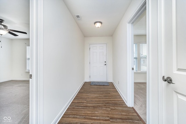 107 Elliott Ave, Trafalgar, IN 46181 - entryway with a ceiling fan, dark carpet, baseboards, and dark wood-style flooring