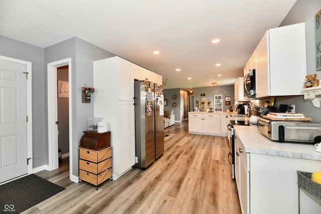 5190 N State Road 213, Windfall, IN 46076 - kitchen featuring stainless steel appliances, light countertops, white cabinets, recessed lighting, and light wood-type flooring