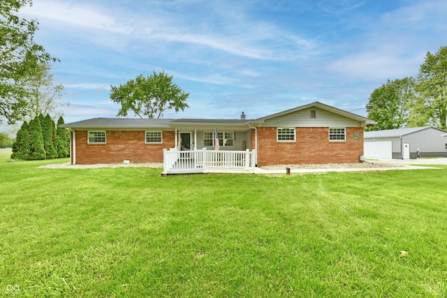 5190 N State Road 213, Windfall, IN 46076 - rear view of property featuring brick siding, a yard, a porch, and a garage