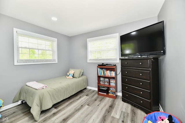 5190 N State Road 213, Windfall, IN 46076 - bedroom featuring light wood-style floors, multiple windows, baseboards, and recessed lighting