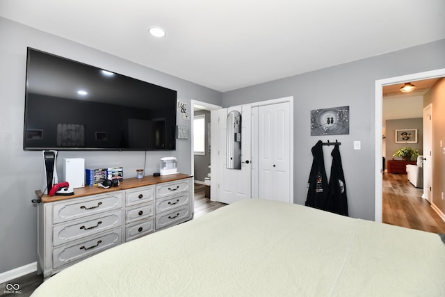 5190 N State Road 213, Windfall, IN 46076 - bedroom featuring wood finished floors, baseboards, a closet, and recessed lighting
