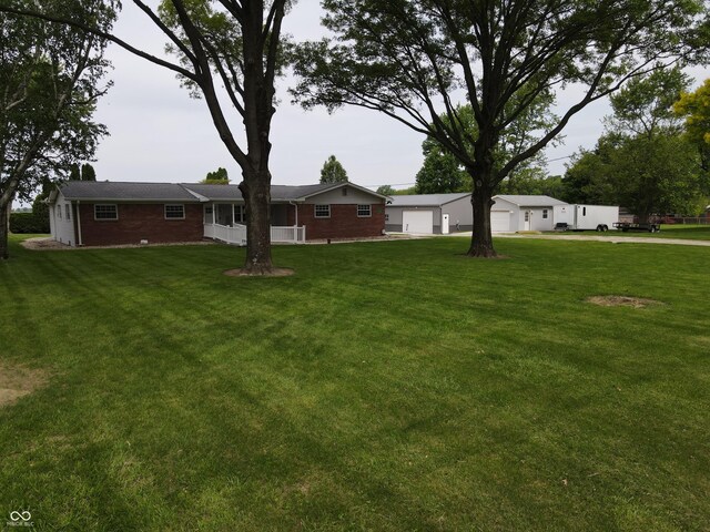 5190 N State Road 213, Windfall, IN 46076 - view of grassy yard with a garage