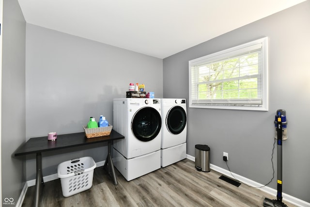 5190 N State Road 213, Windfall, IN 46076 - laundry area featuring washing machine and dryer, wood finished floors, and baseboards