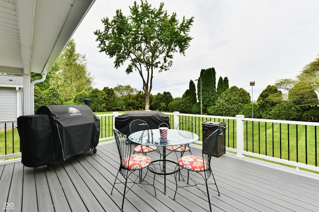 5190 N State Road 213, Windfall, IN 46076 - deck featuring outdoor dining area, a lawn, view of wooded area, and a grill