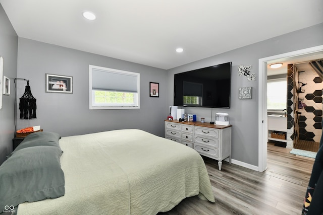 5190 N State Road 213, Windfall, IN 46076 - bedroom with wood finished floors, recessed lighting, and baseboards