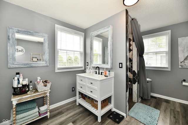 5190 N State Road 213, Windfall, IN 46076 - full bath featuring wood finished floors, vanity, baseboards, and a textured ceiling