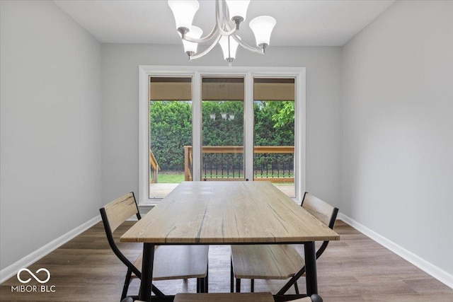 601 Woodbine, Terre Haute, IN 47803 - dining area with a chandelier, baseboards, and wood finished floors