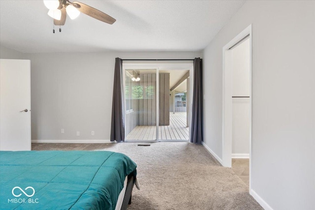 601 Woodbine, Terre Haute, IN 47803 - carpeted bedroom with access to exterior, baseboards, ceiling fan, and a textured ceiling