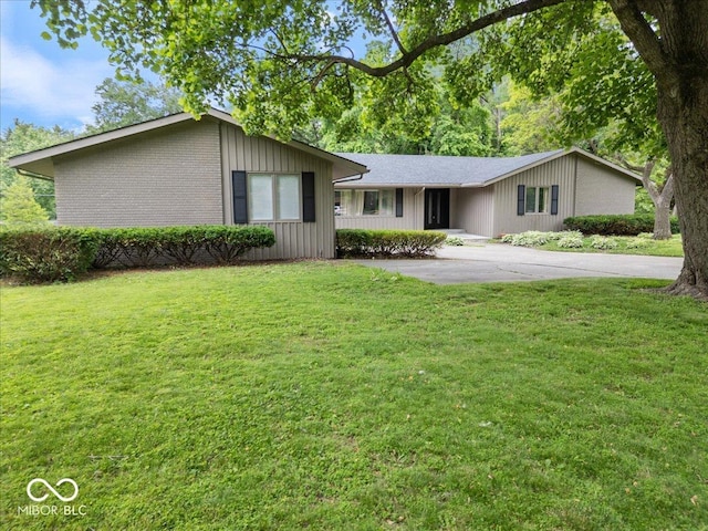 601 Woodbine, Terre Haute, IN 47803 - view of front of property with a front yard, brick siding, and driveway