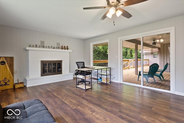601 Woodbine, Terre Haute, IN 47803 - living room featuring ceiling fan, wood finished floors, and a fireplace