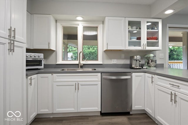 601 Woodbine, Terre Haute, IN 47803 - kitchen with stainless steel dishwasher, a sink, white cabinetry, glass insert cabinets, and recessed lighting