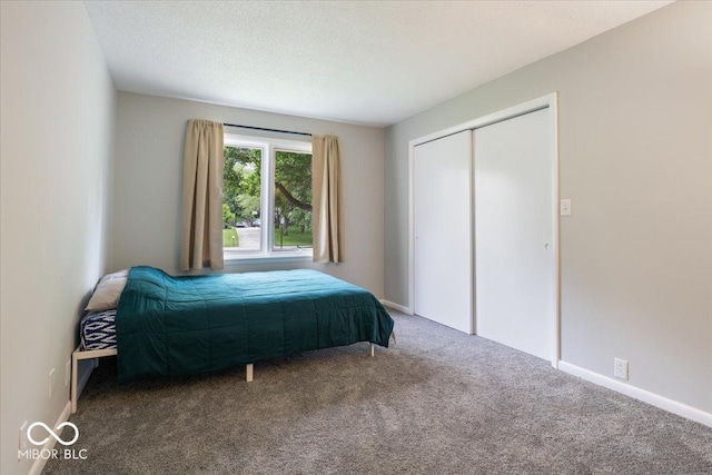 601 Woodbine, Terre Haute, IN 47803 - bedroom featuring carpet floors, a closet, and baseboards