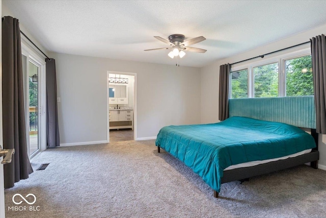 601 Woodbine, Terre Haute, IN 47803 - bedroom featuring carpet, baseboards, ensuite bathroom, ceiling fan, and a textured ceiling
