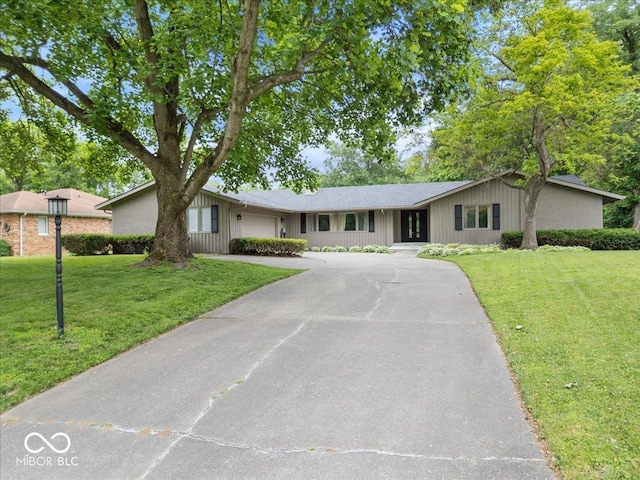 601 Woodbine, Terre Haute, IN 47803 - ranch-style home with a garage, asphalt driveway, a front yard, and a shingled roof