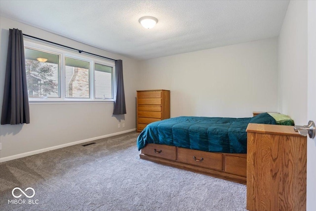 601 Woodbine, Terre Haute, IN 47803 - carpeted bedroom with baseboards and a textured ceiling