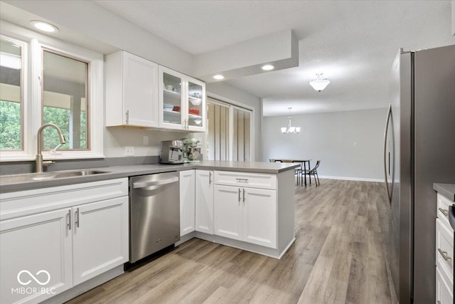 601 Woodbine, Terre Haute, IN 47803 - kitchen with appliances with stainless steel finishes, a sink, a peninsula, light wood finished floors, and recessed lighting