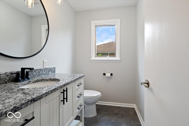 601 Woodbine, Terre Haute, IN 47803 - bathroom featuring vanity, baseboards, and toilet